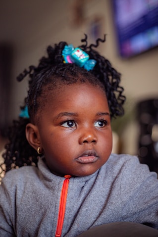 A little girl with a bow in her hair