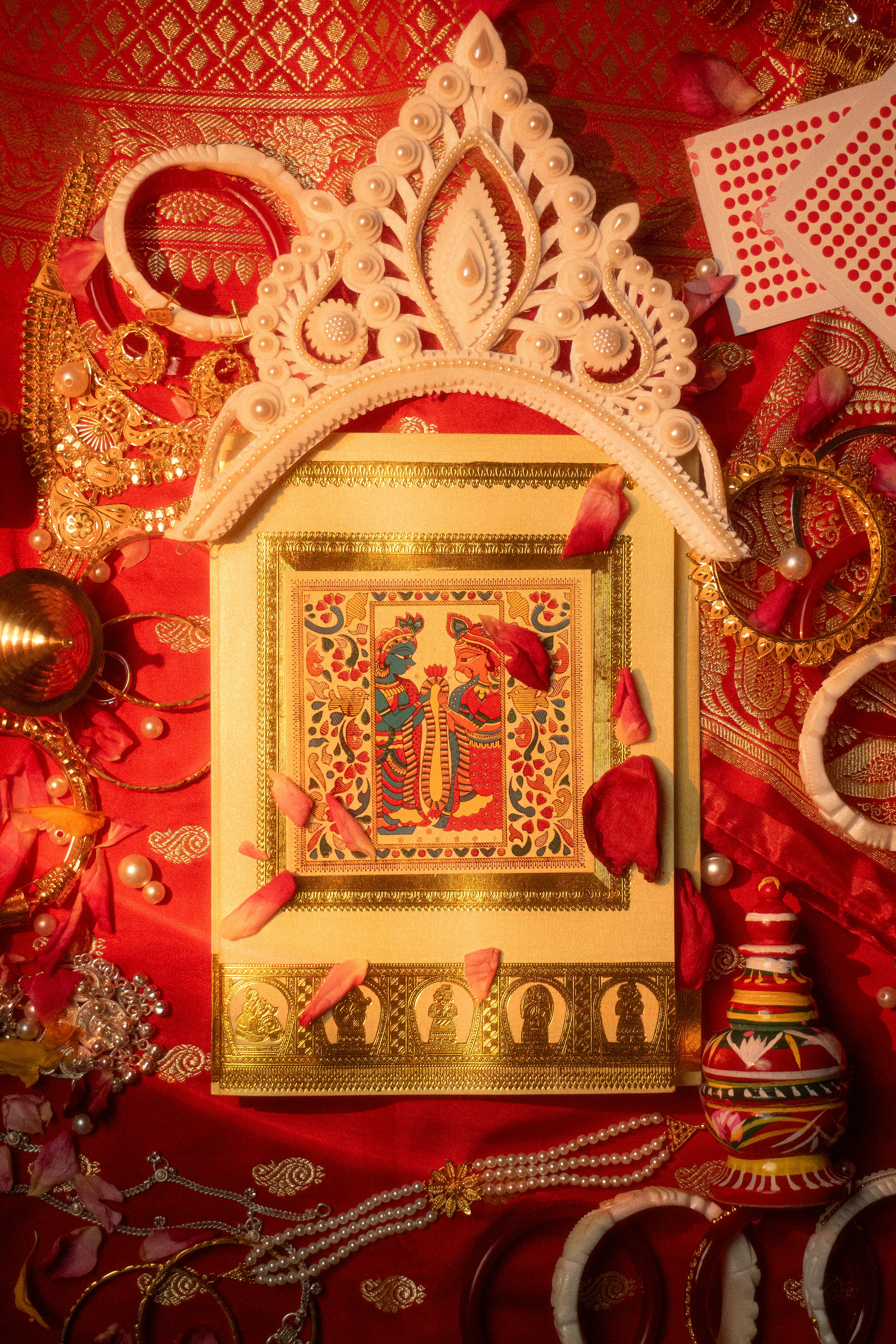 Hand-painted mandala art with golden accents