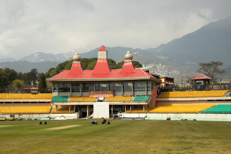 Cricket stadium with mountains behind