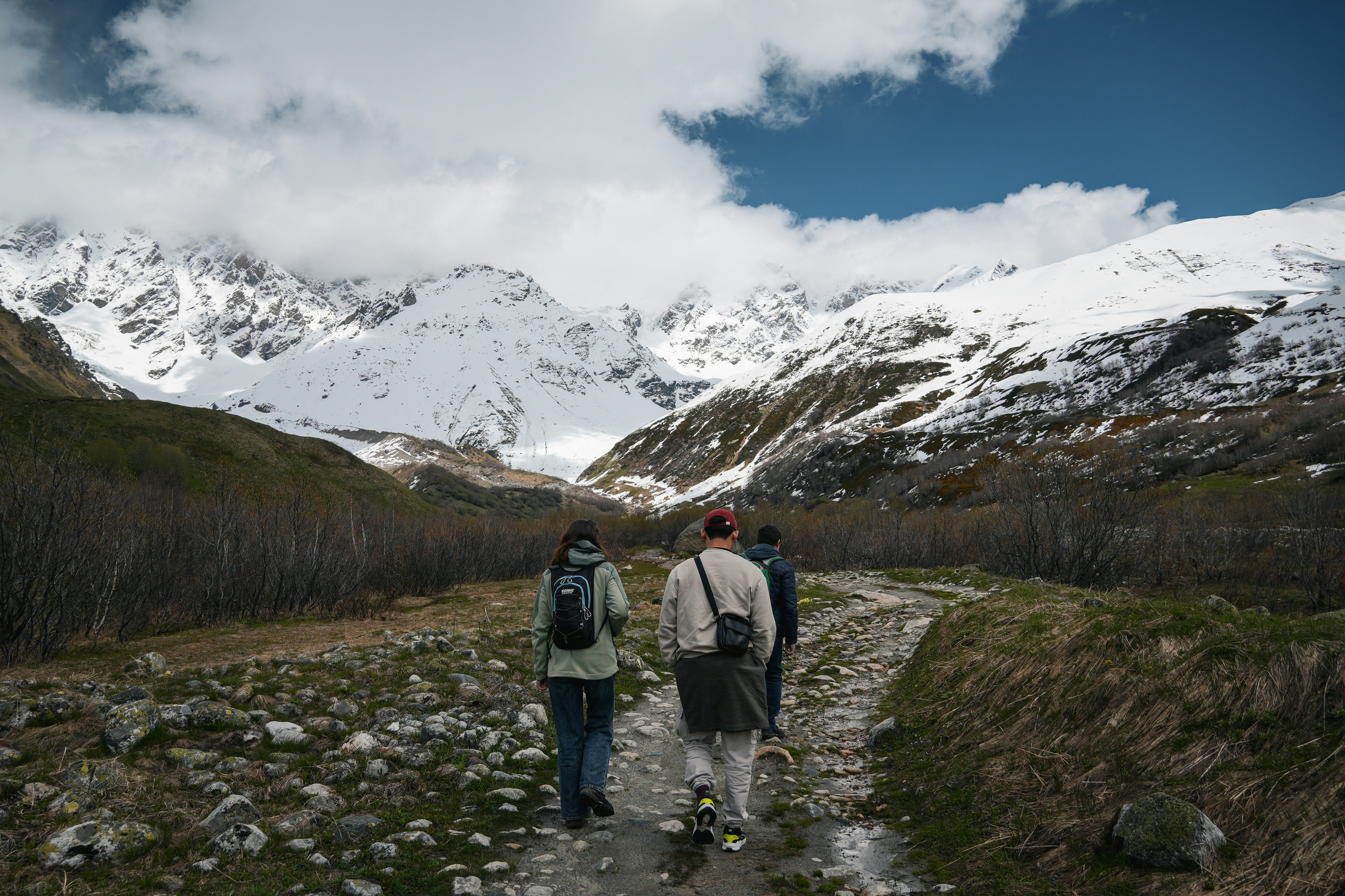 A couple walking down a dirt path