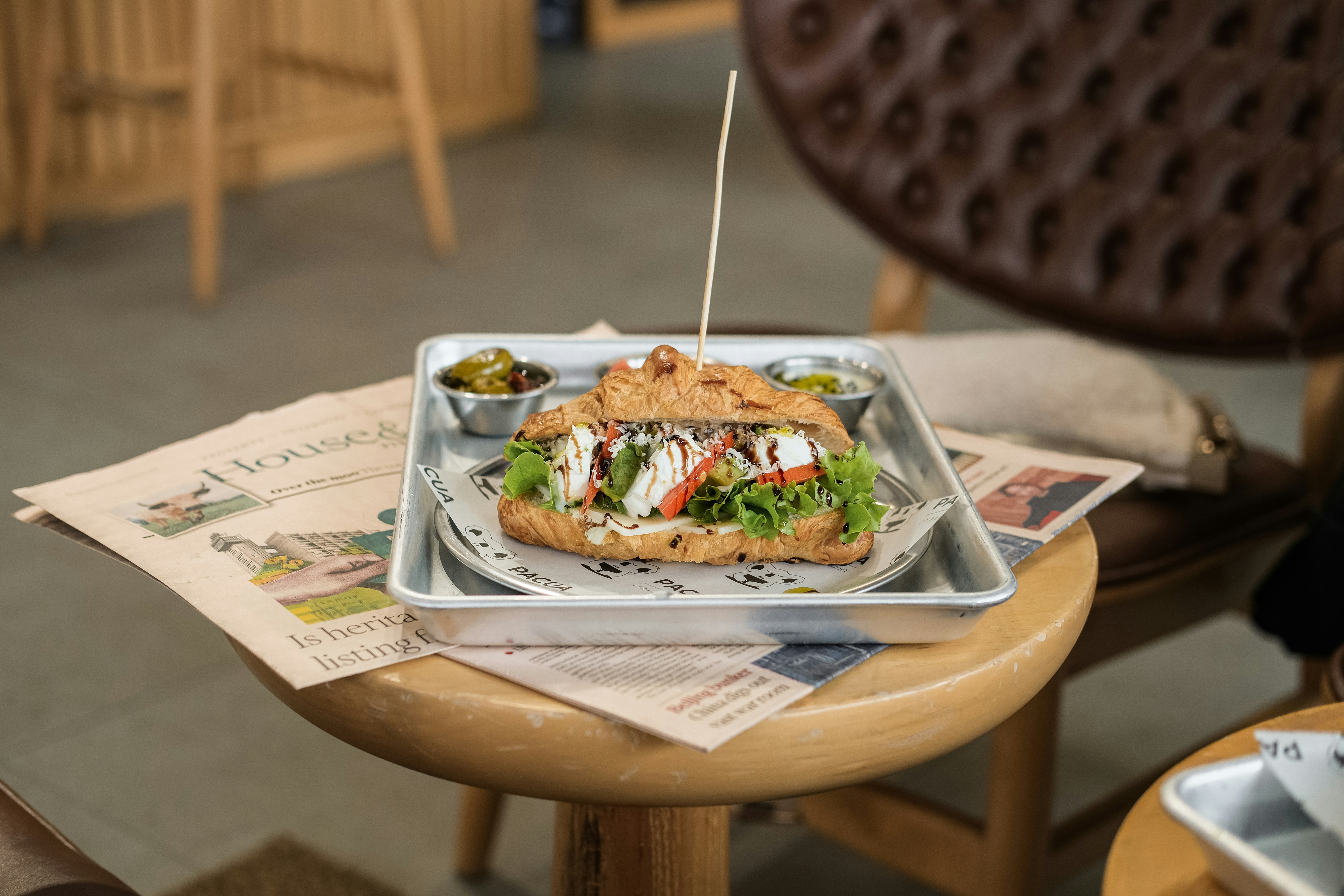 Sandwich on a metal tray with a toothpick