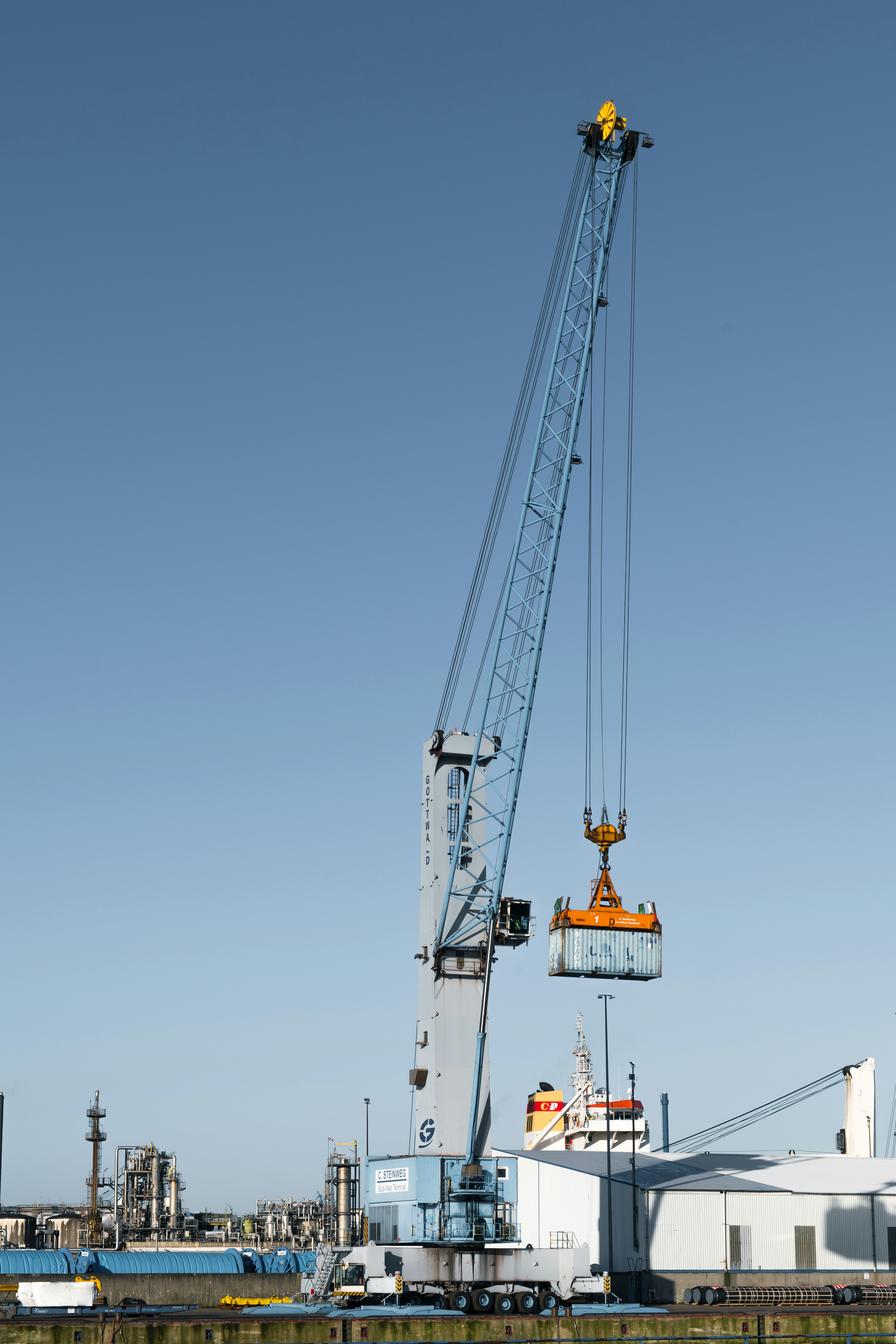 woman wearing yellow long-sleeved dress under white clouds and blue sky during daytime
