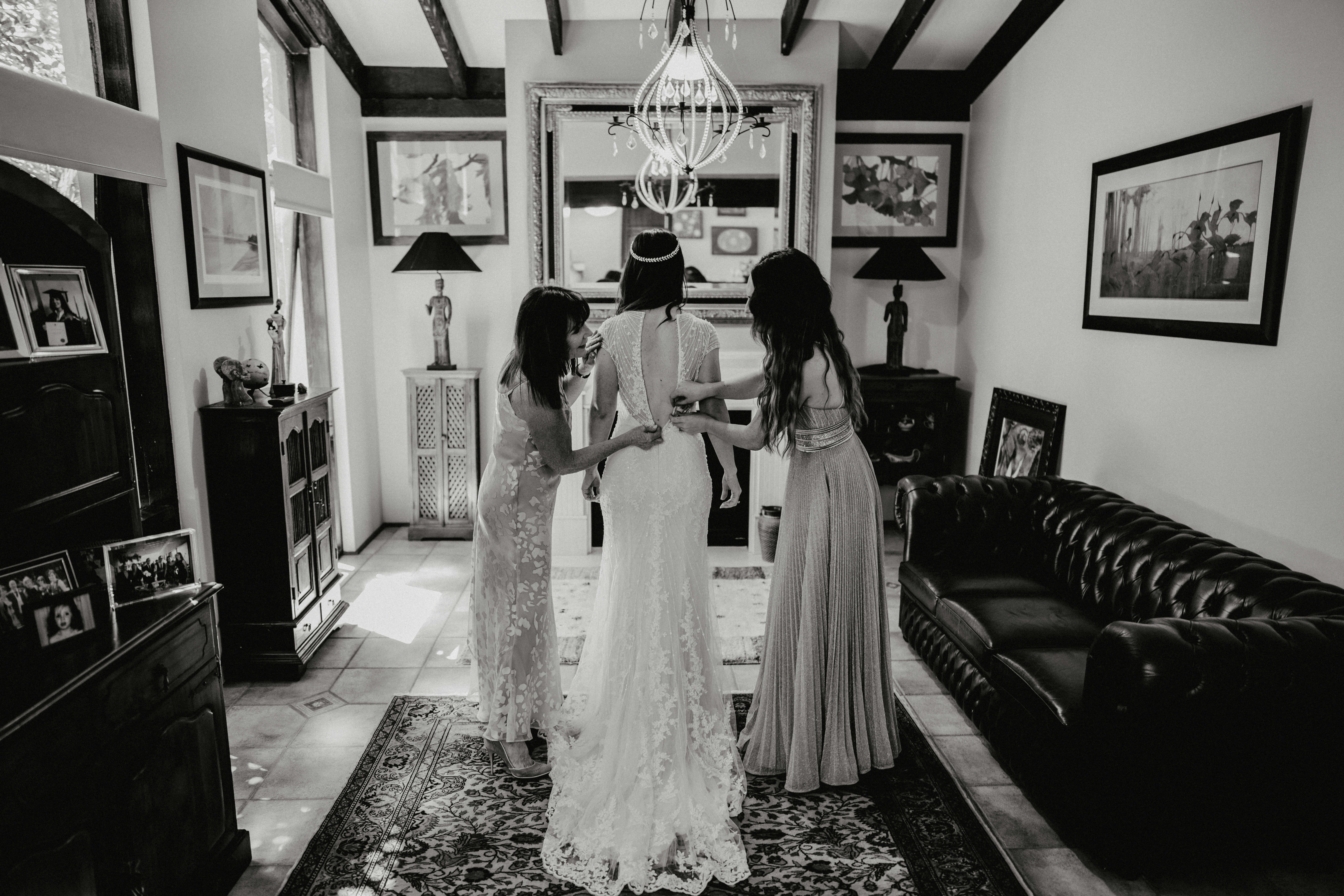 Bride shopping for wedding dress with maid of honor and bridesmaids — maid of honor duties guide by Prévu Events and Design