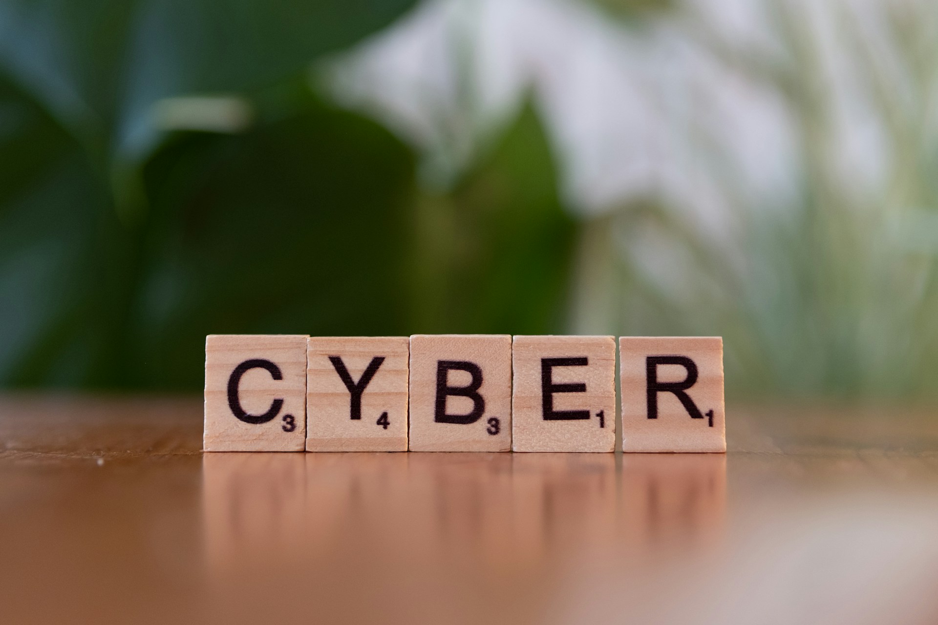 A scrabble type block spelling the word cyber