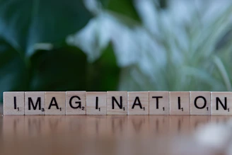 A wooden block that says imagine nation on it