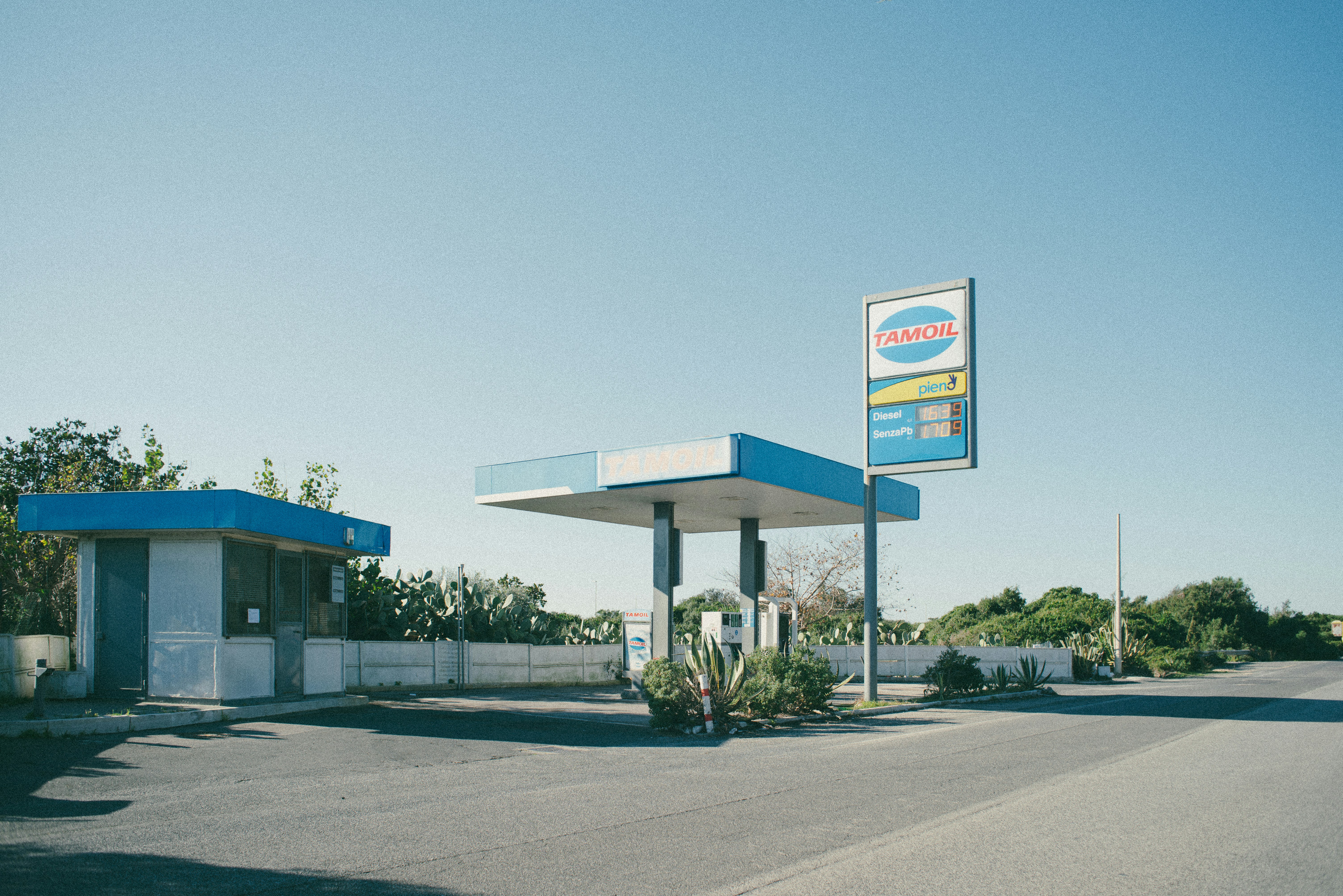 A gas station with a sign for a gas station