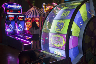 A colorful video game machine in a dark room
