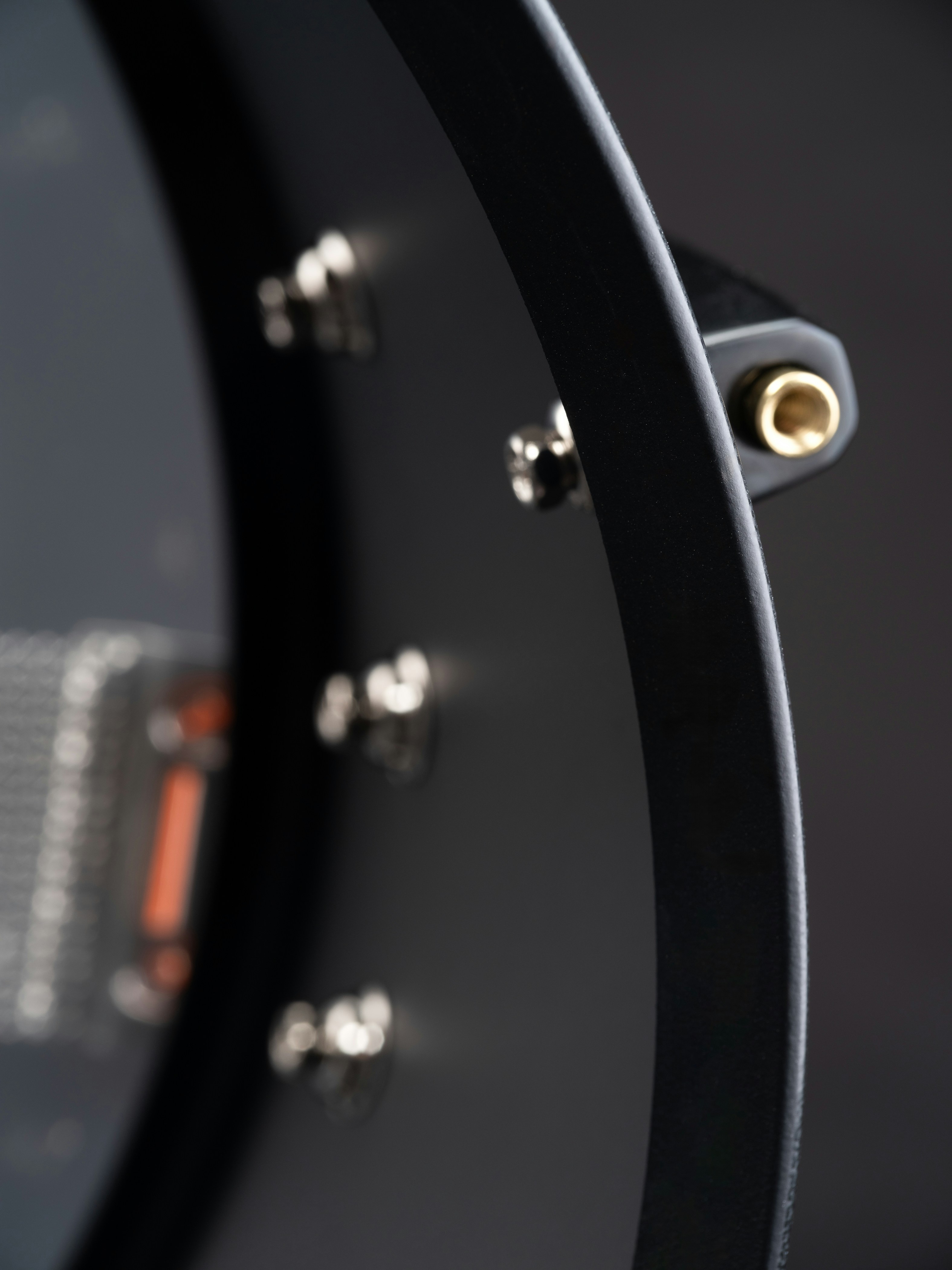 A close up of a black drum head