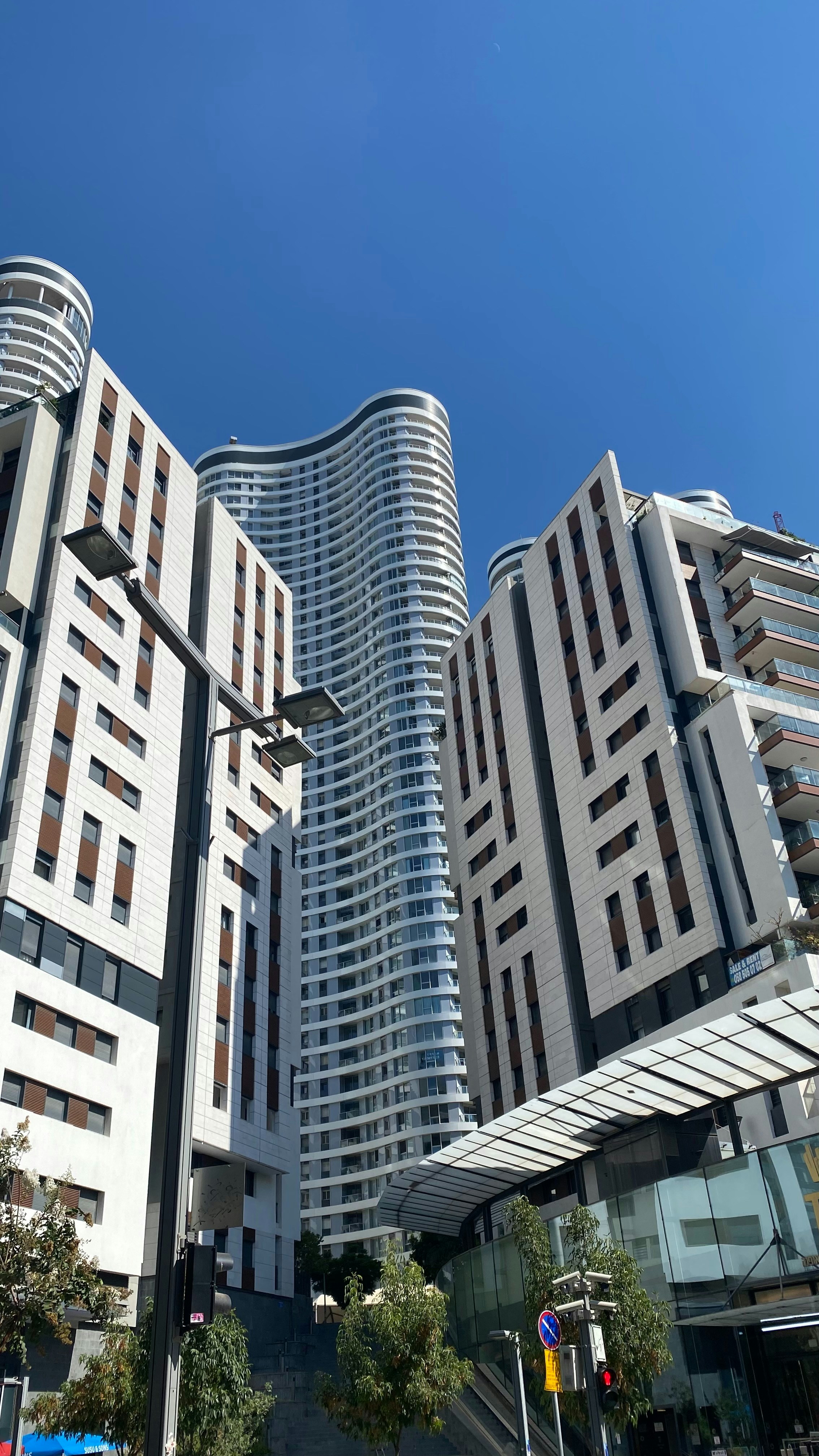 A group of tall buildings sitting next to each other