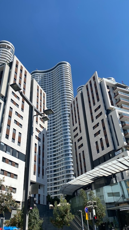 A group of tall buildings sitting next to each other