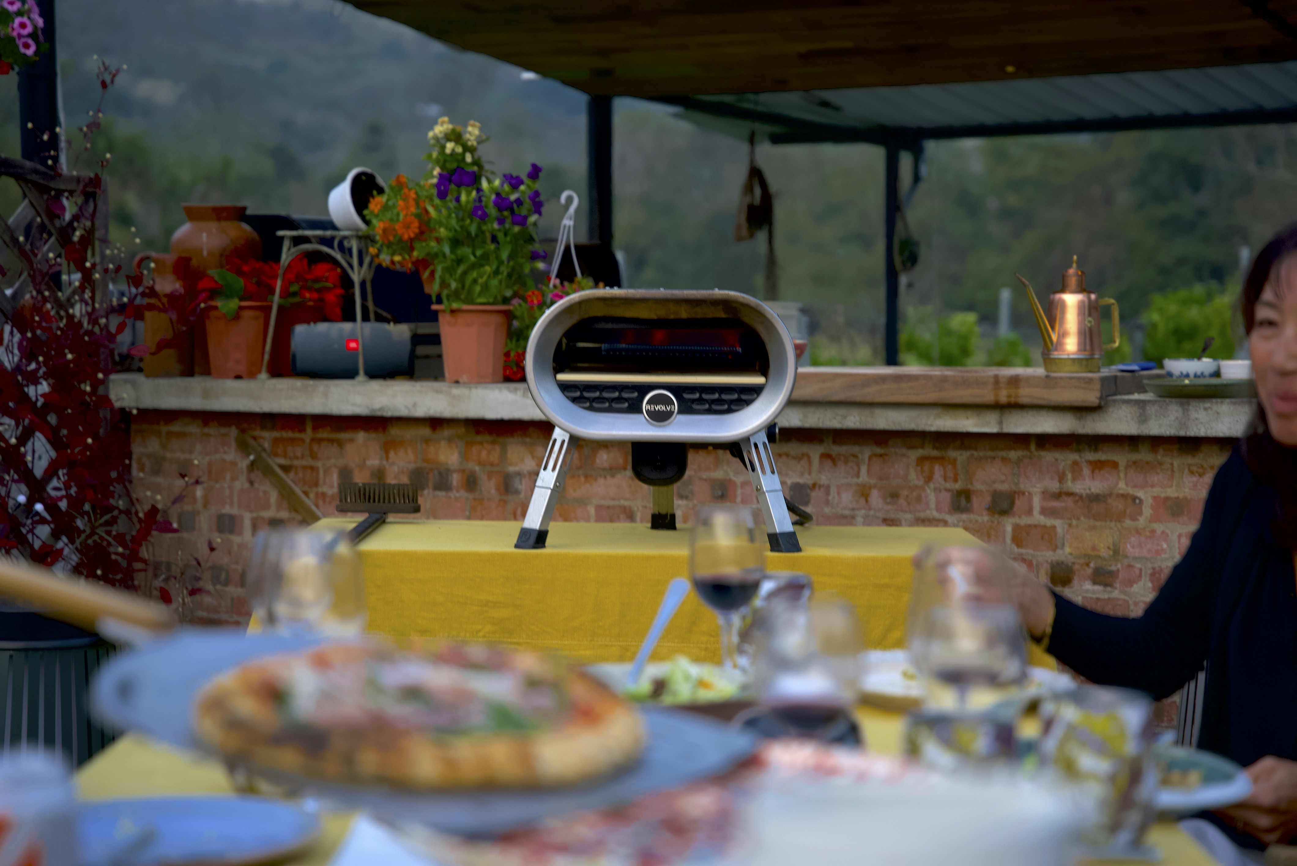 A woman sitting at a table with food on it
