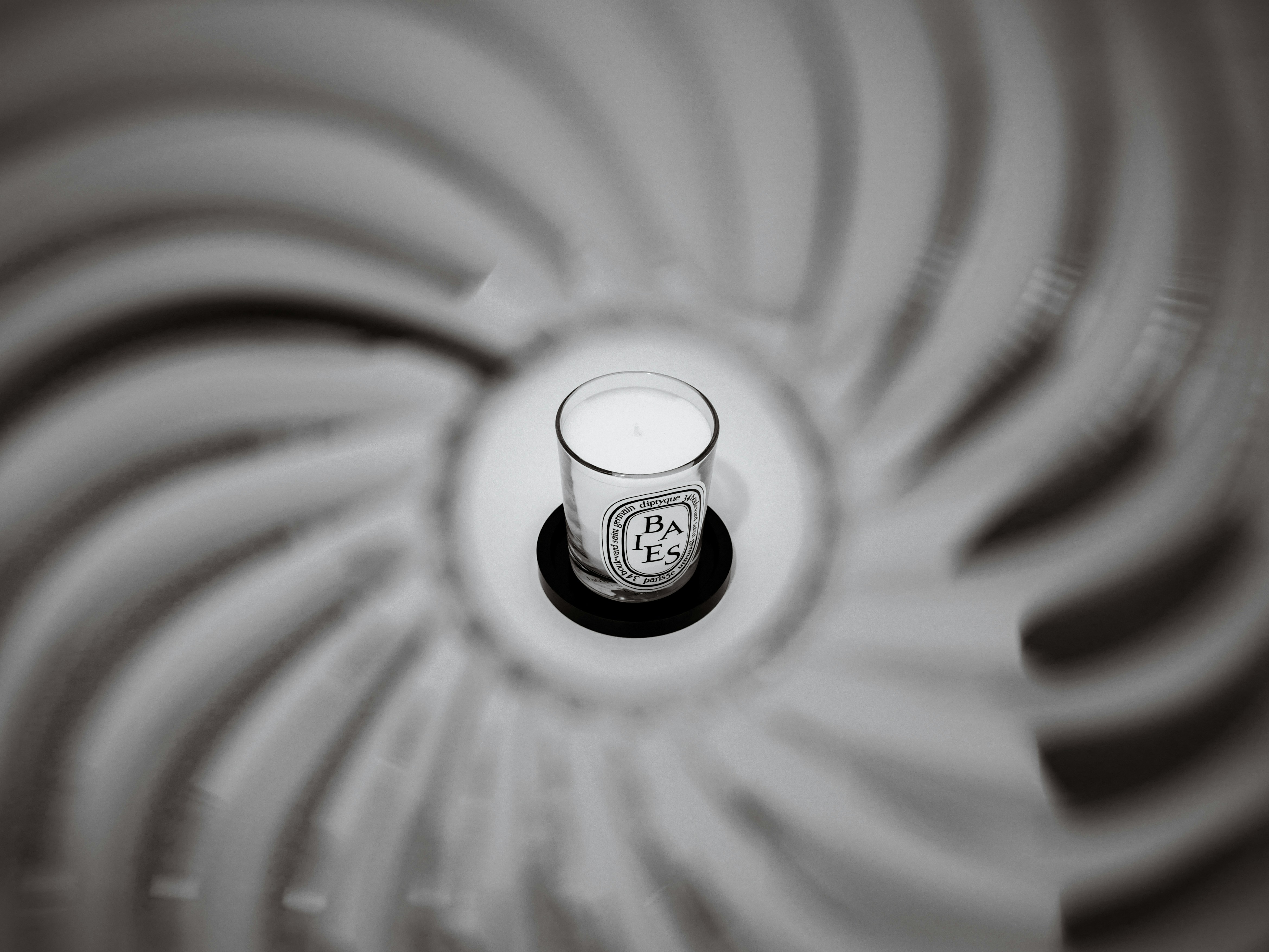 A close up of a glass with a liquid inside of it