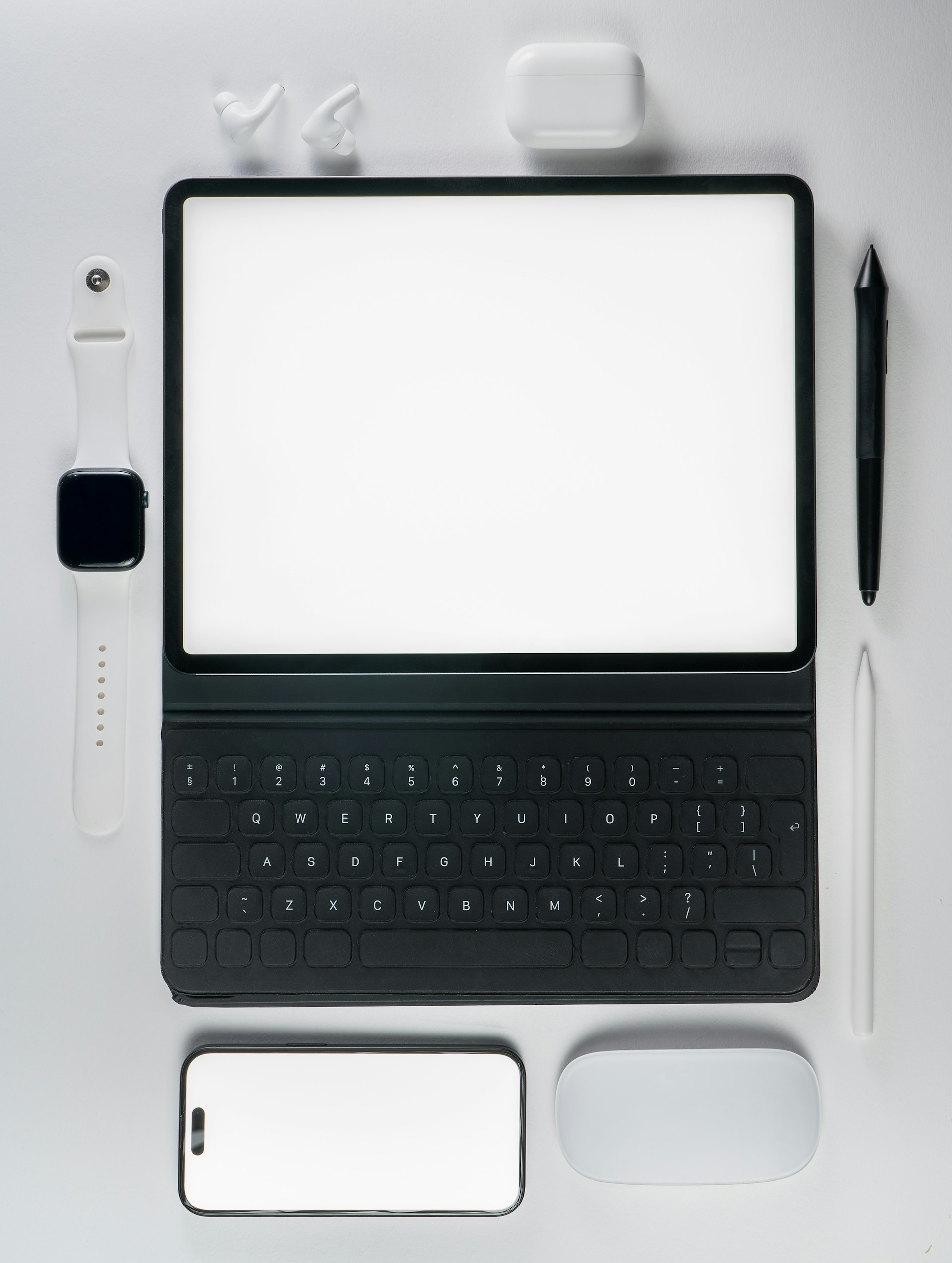 A laptop computer sitting on top of a white table