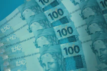 A bunch of money sitting on top of each other