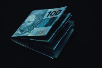 A stack of money sitting on top of each other