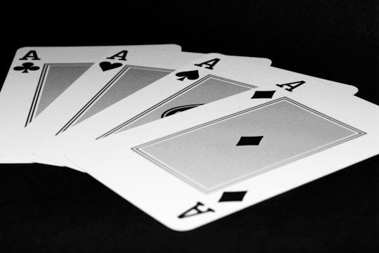 Four of a kind of playing cards on a table
