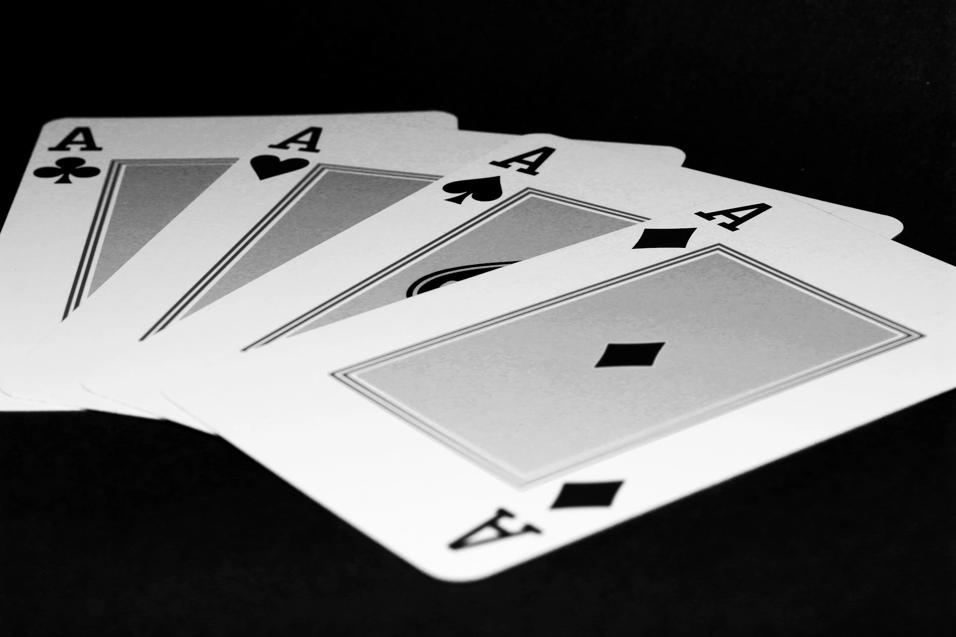 Four of a kind of playing cards on a table