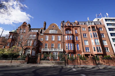 A row of red brick buildings on a city street