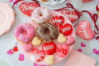 A plate of valentine's day treats on a table