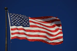 An american flag waving in the wind