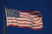 An american flag waving in the wind