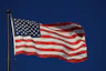 An american flag waving in the wind