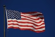 An american flag waving in the wind