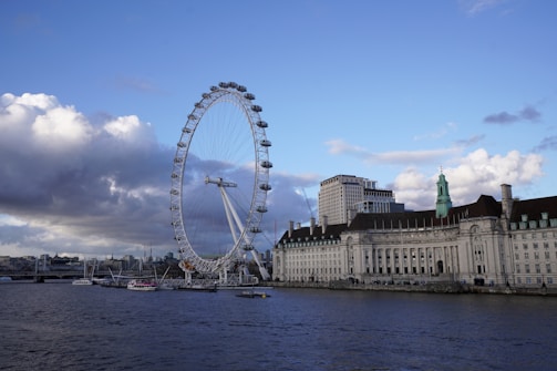 A large ferris wheel in the middle of a body of water
