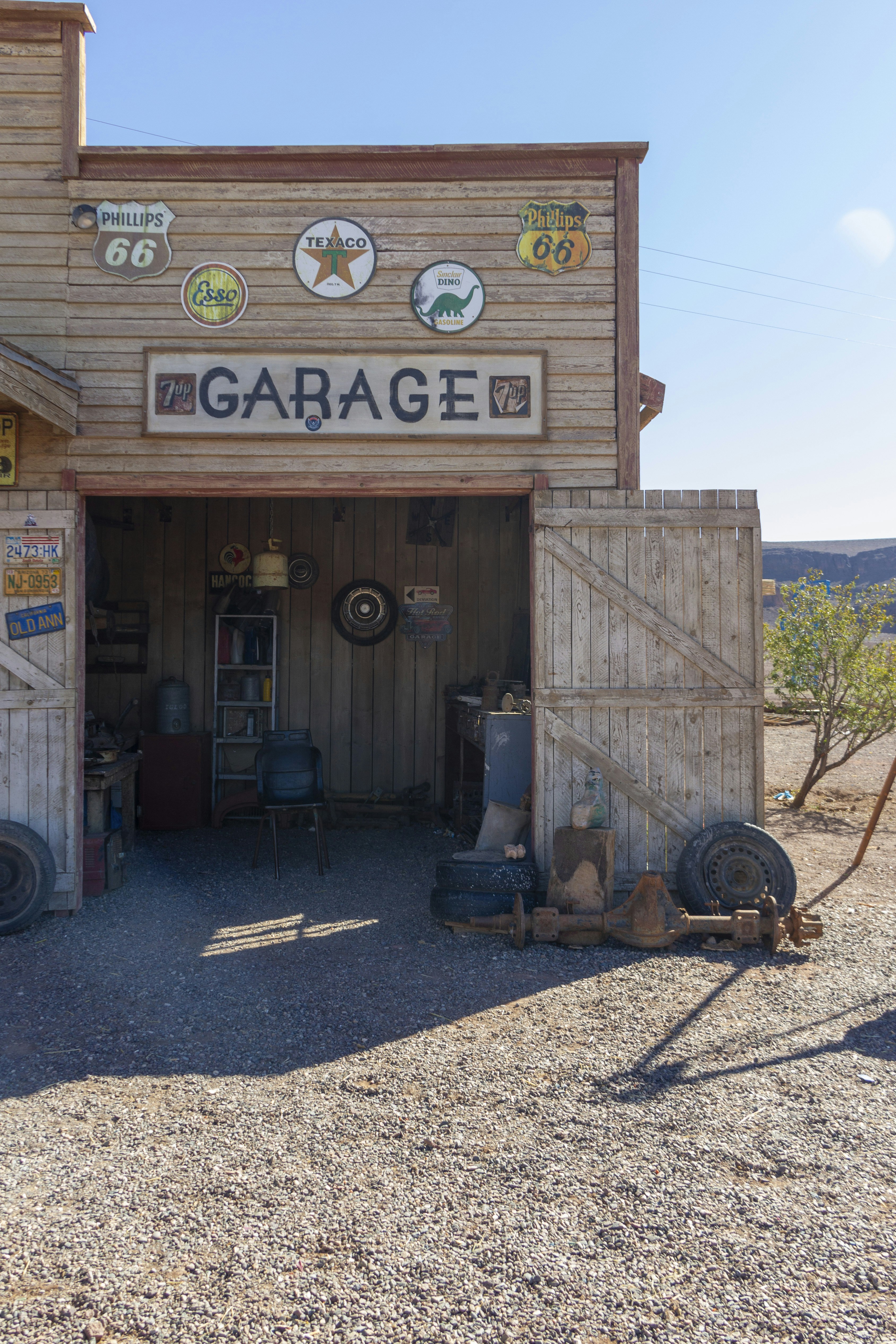A garage with a lot of items on the outside of it