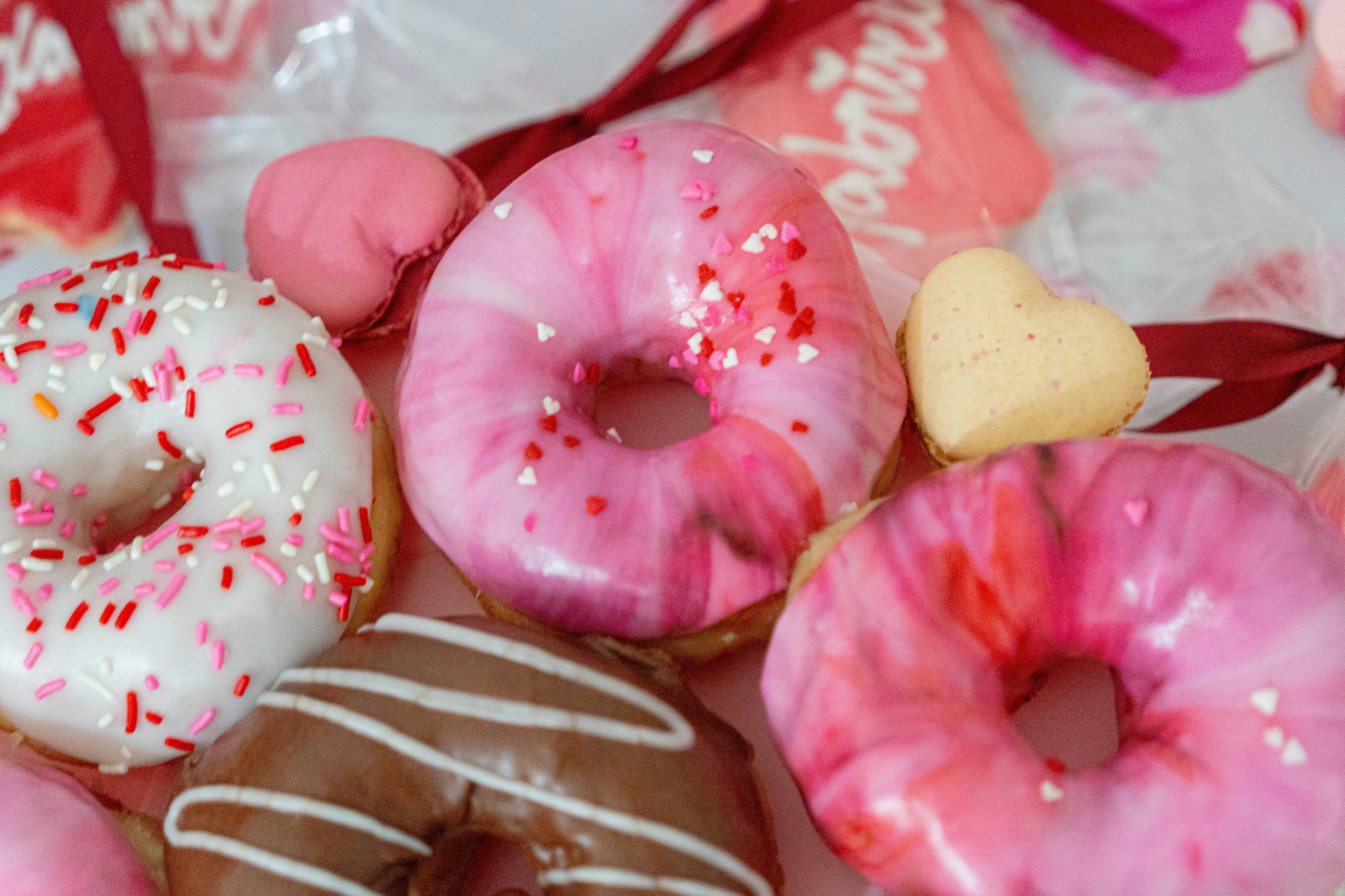A bunch of doughnuts that are on a table