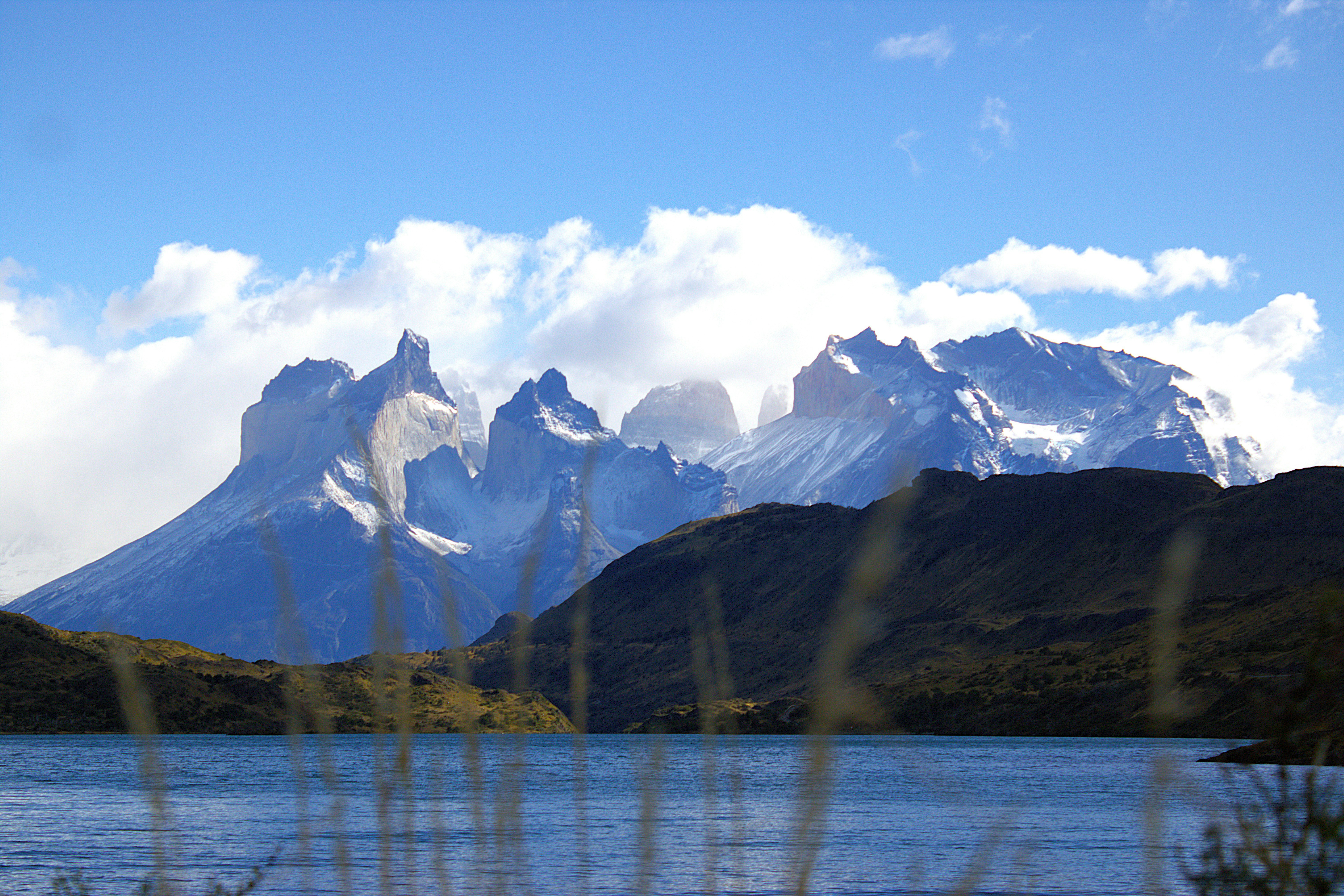 A lake with mountains in the background
