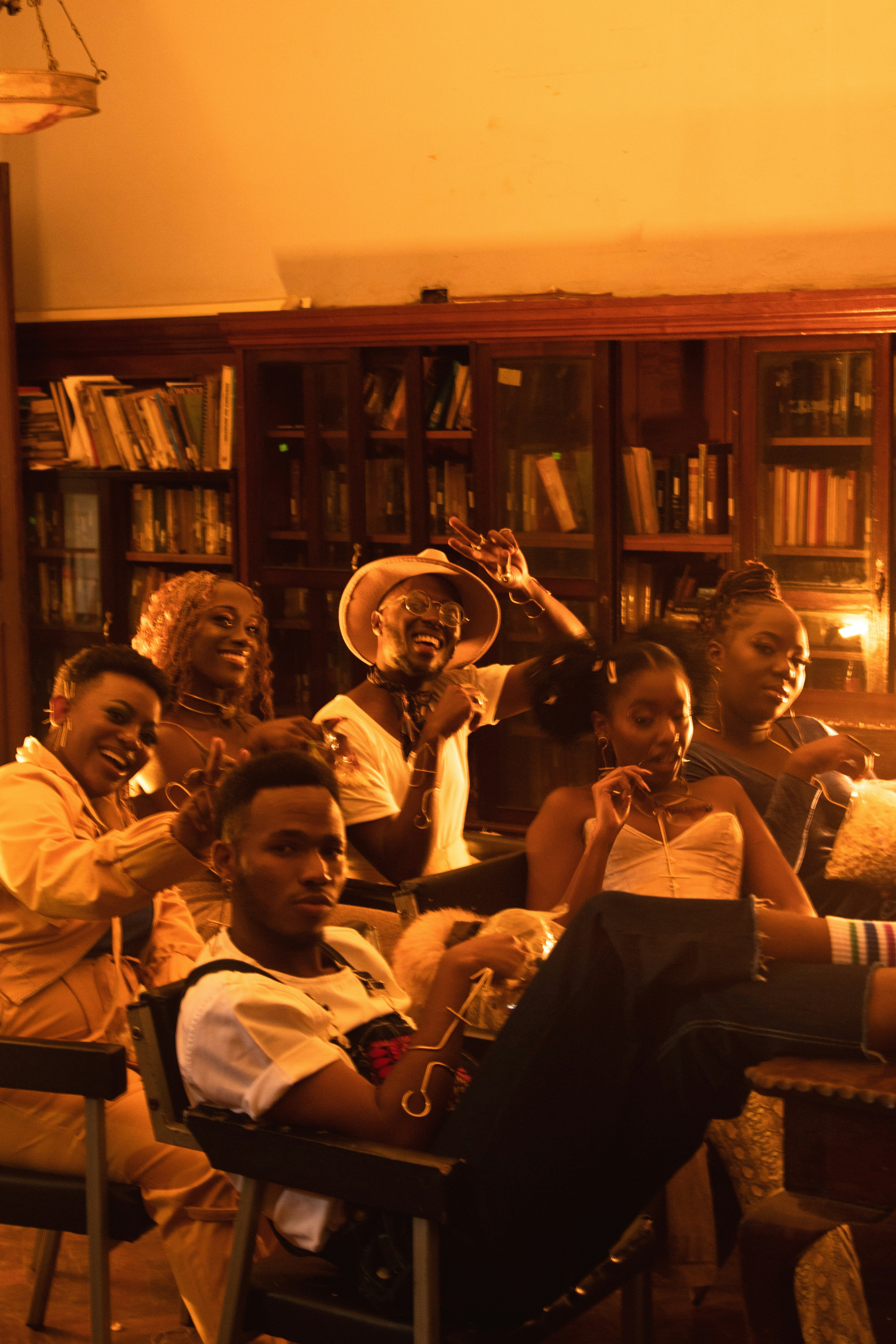 A group of people sitting around each other