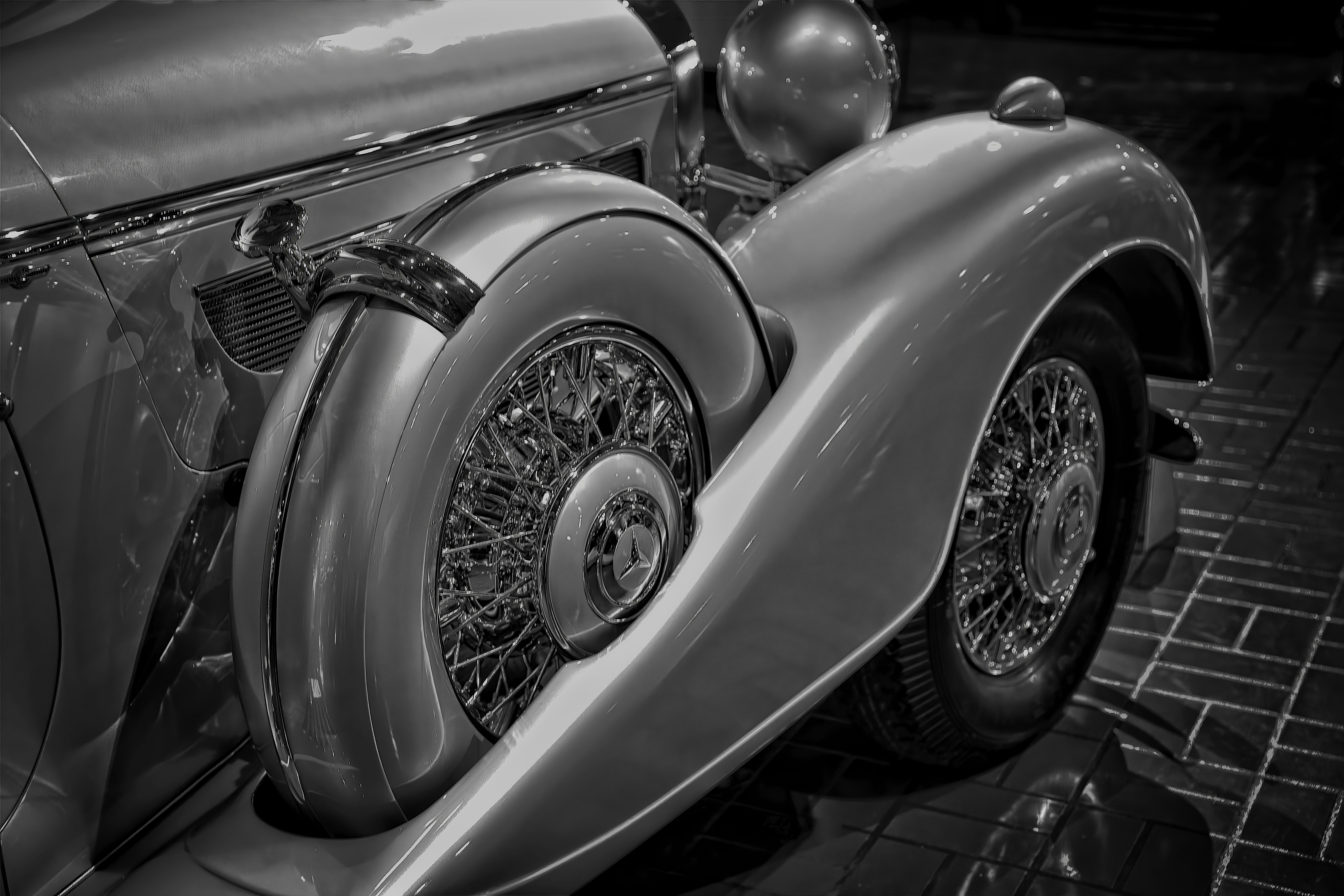 A black and white photo of a vintage car