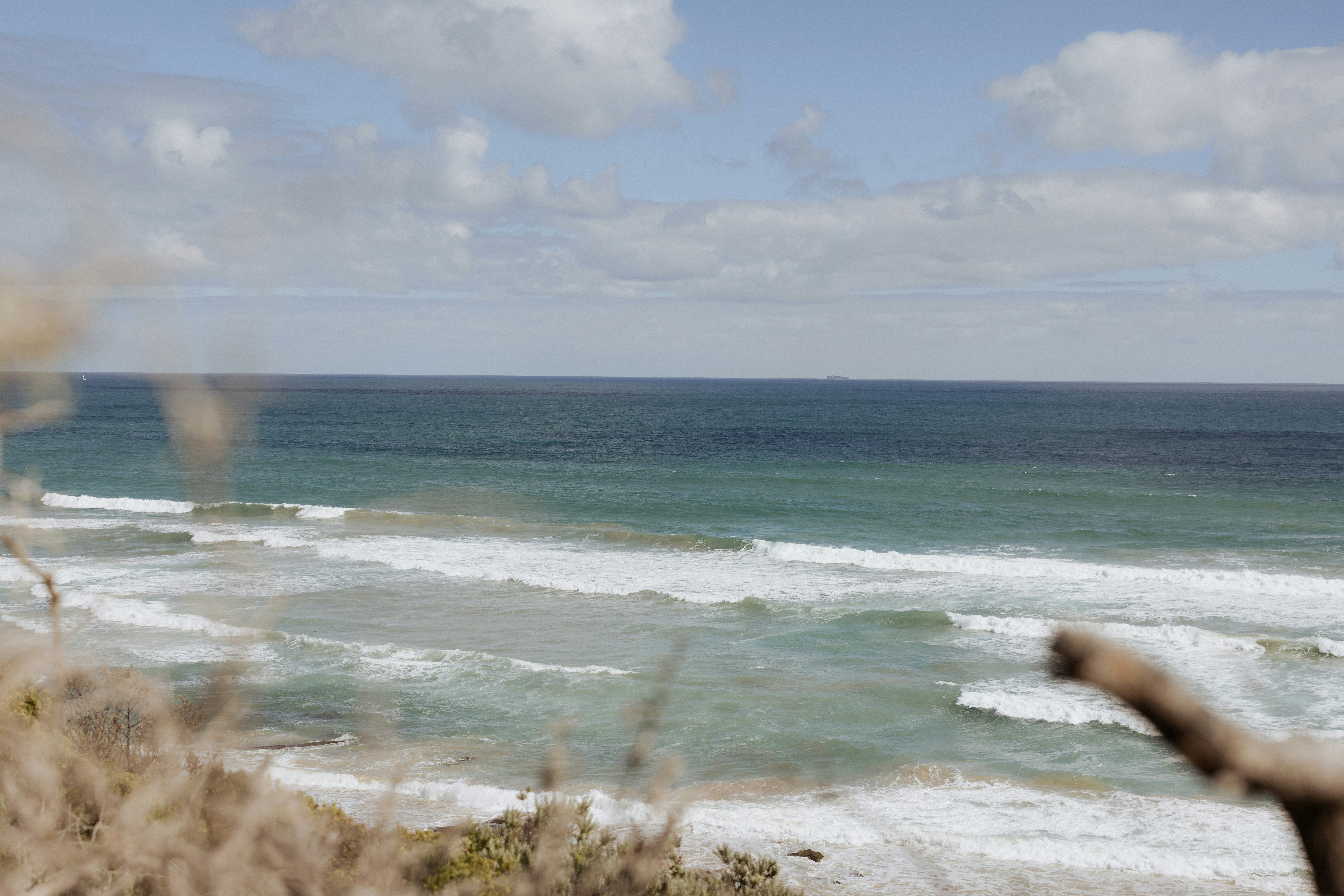 A blurry photo of a beach and ocean