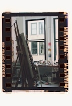 A film strip with a picture of a building in the background