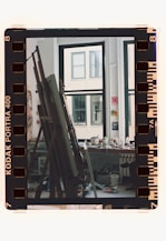 A film strip with a picture of a building in the background