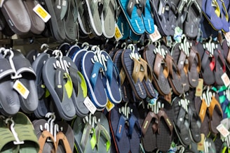 A large display of flip flops for sale in a store