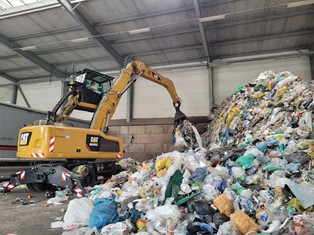 A large pile of trash sitting inside of a building