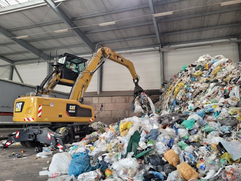 A large pile of trash sitting inside of a building