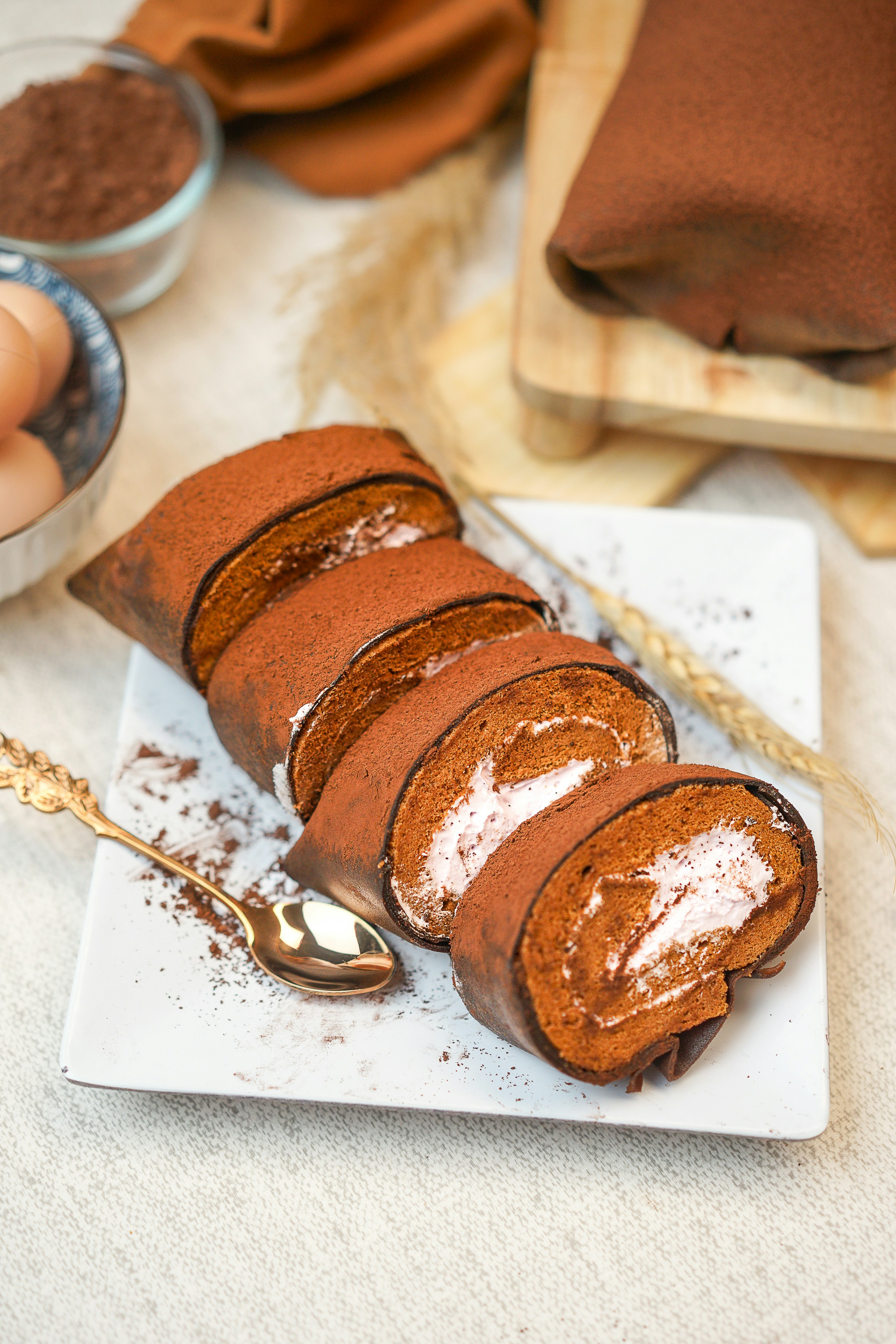 A piece of cake on a plate with a spoon