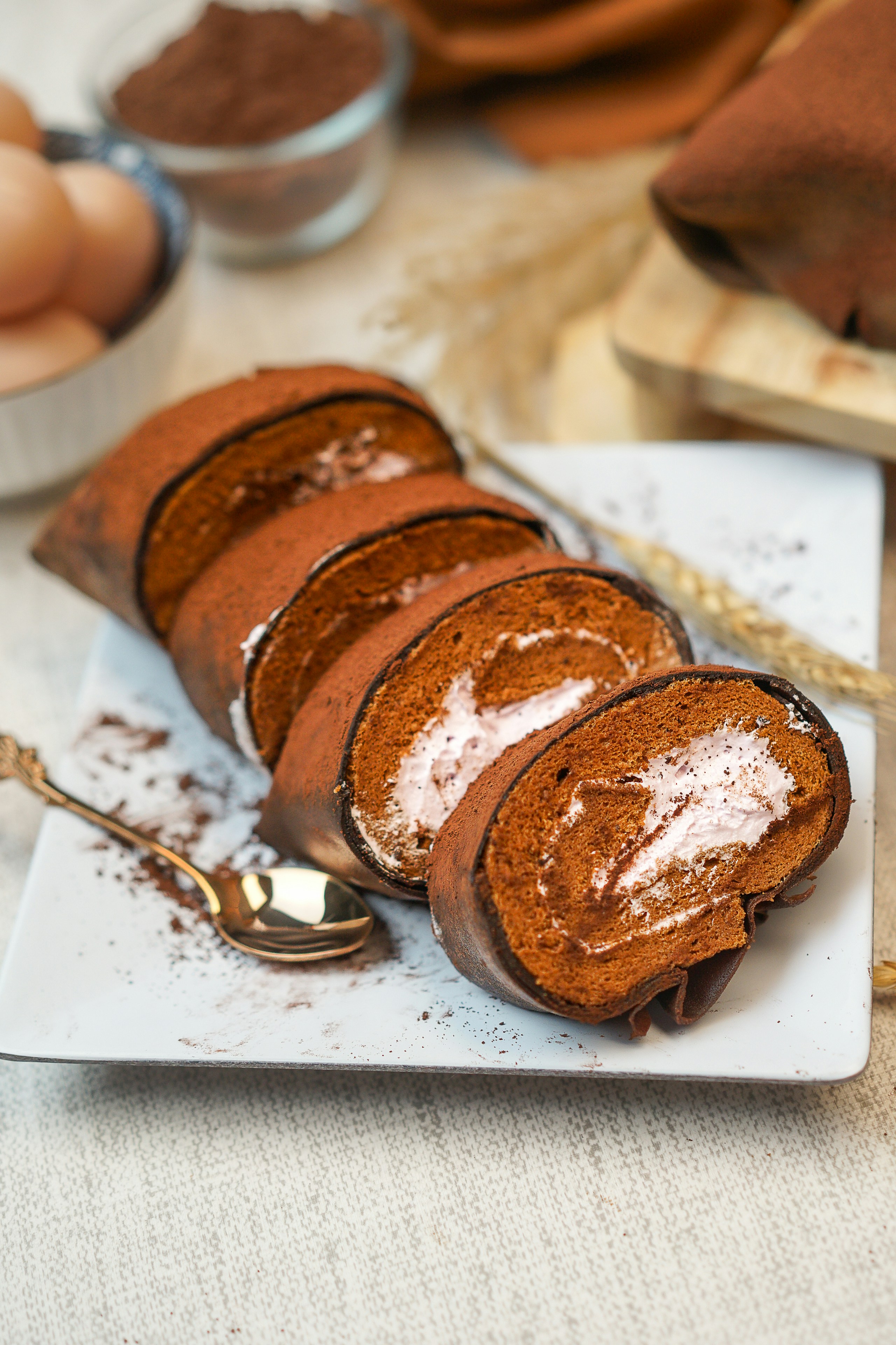 A white plate topped with slices of cake