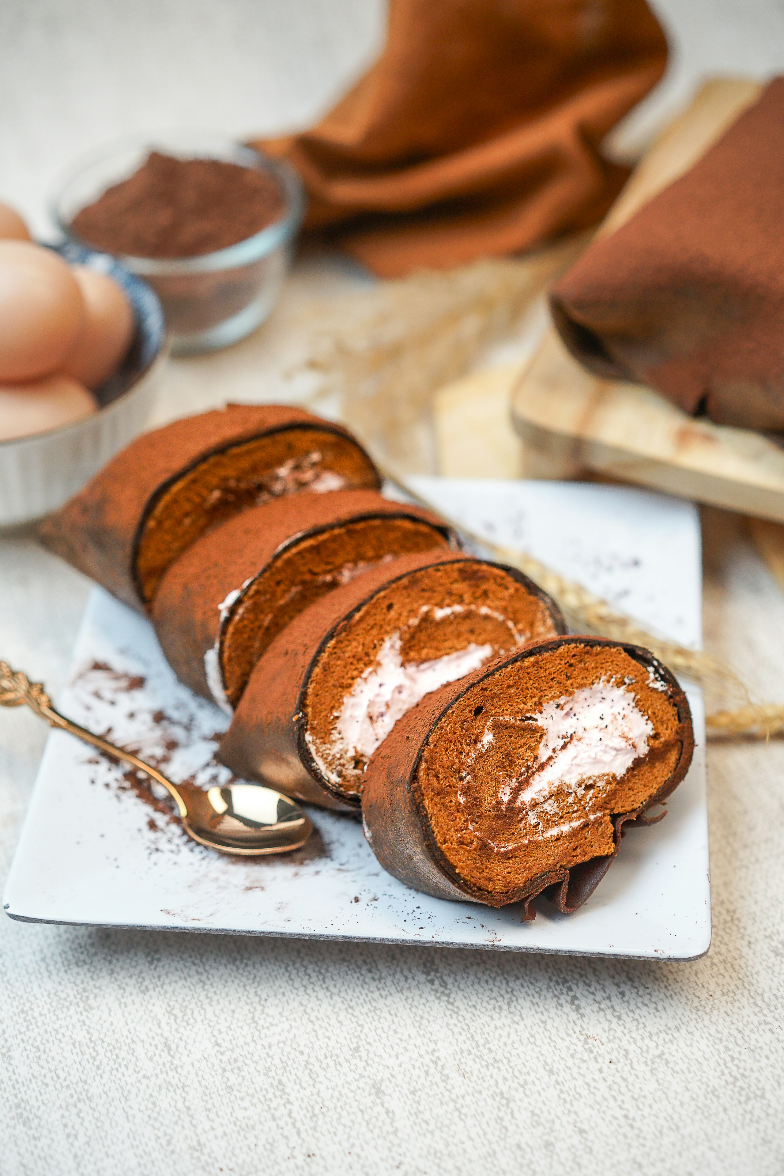 A white plate topped with slices of cake