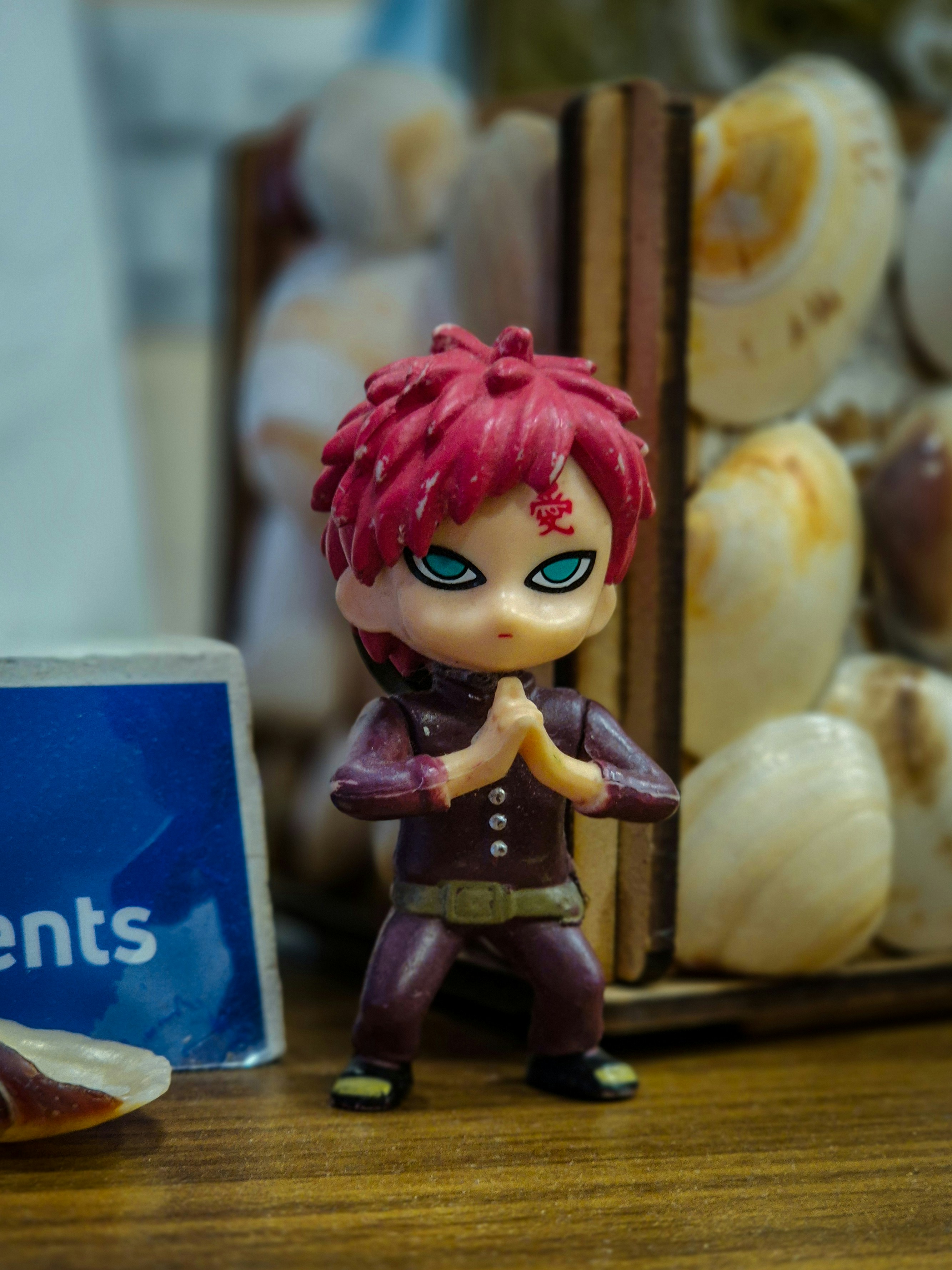A small figurine of a person with red hair