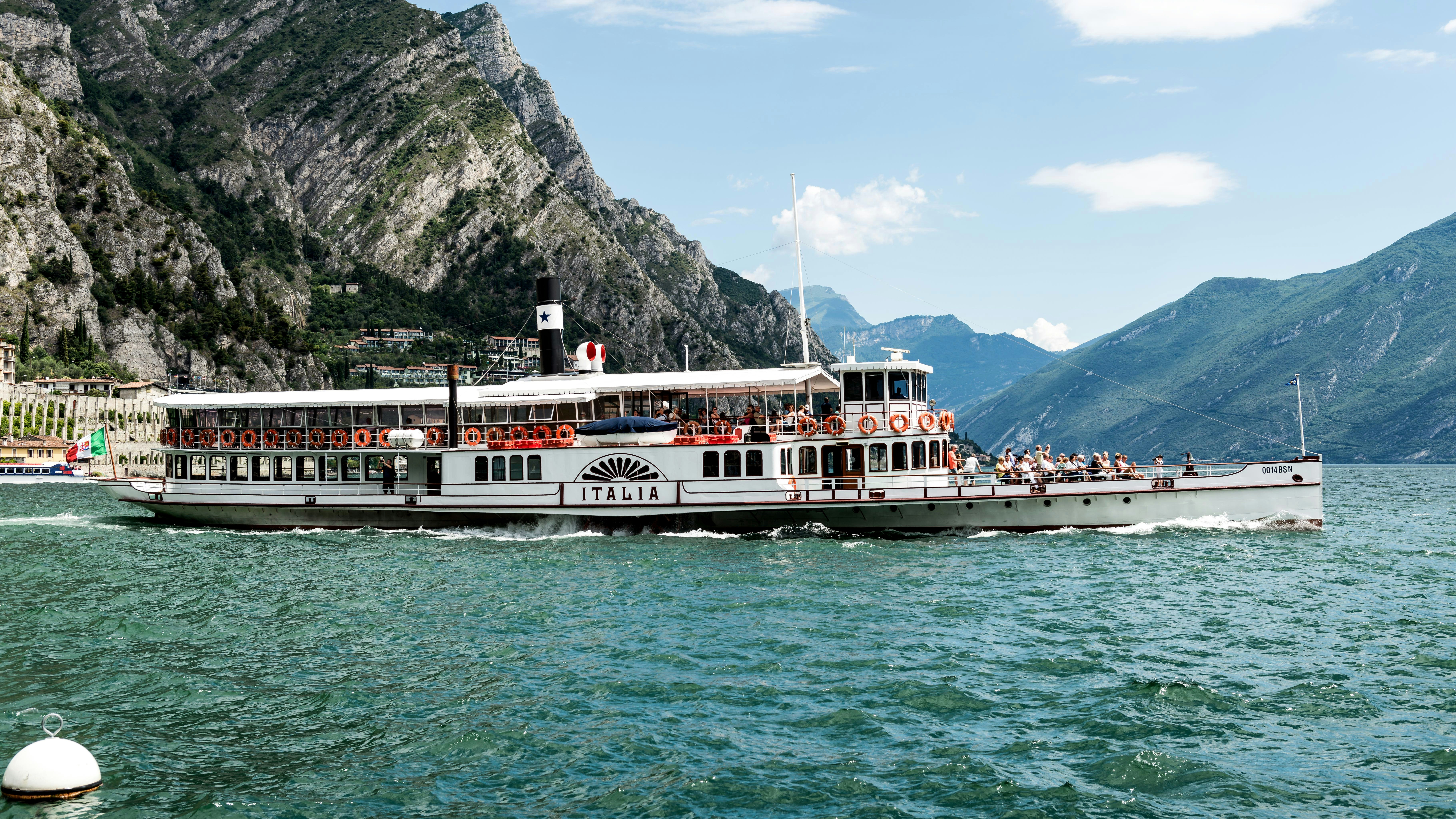 A large white boat floating on top of a body of water