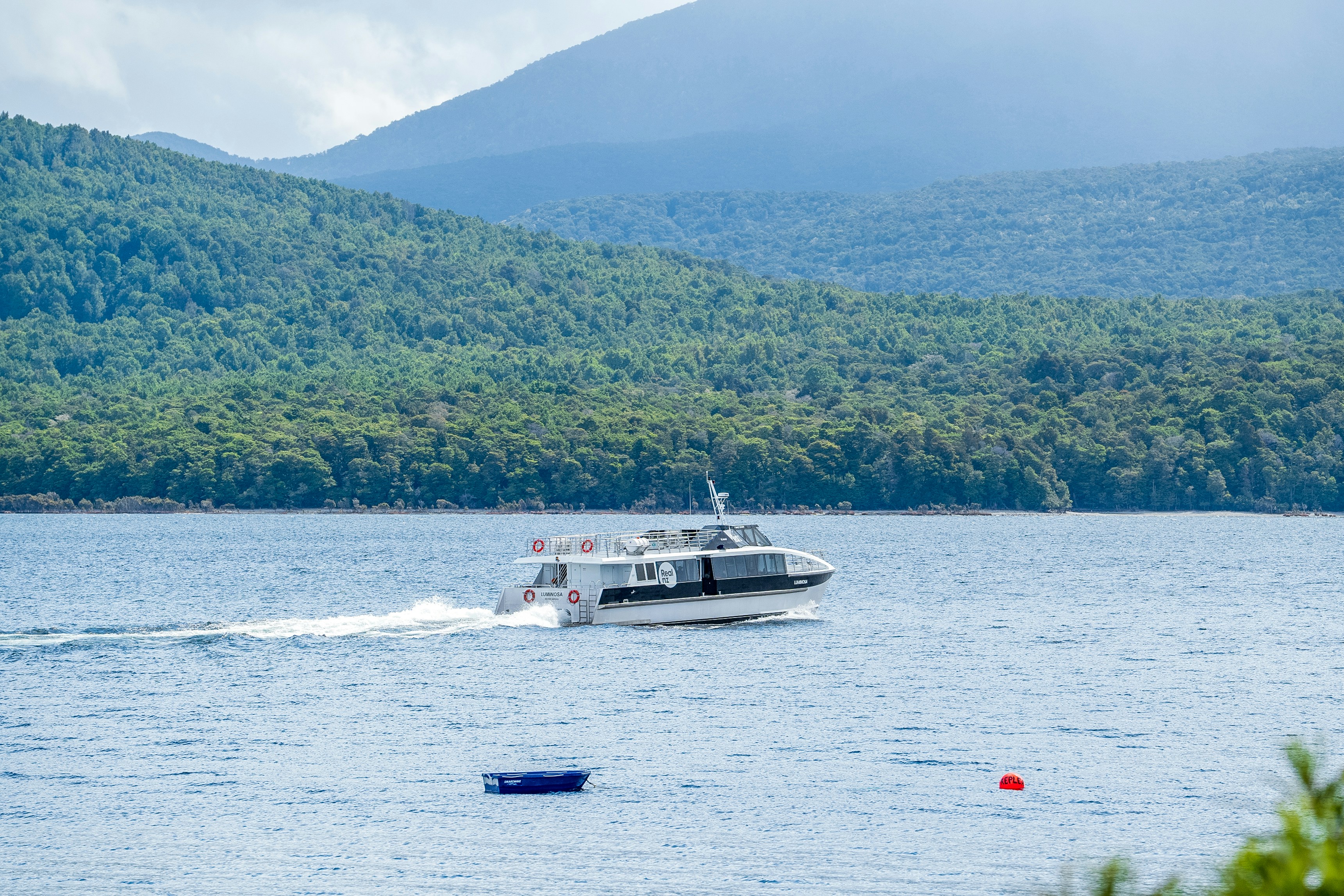 A boat traveling across a large body of water