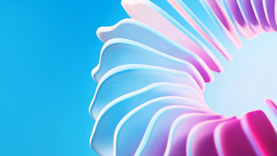 A close up of a pink and blue flower