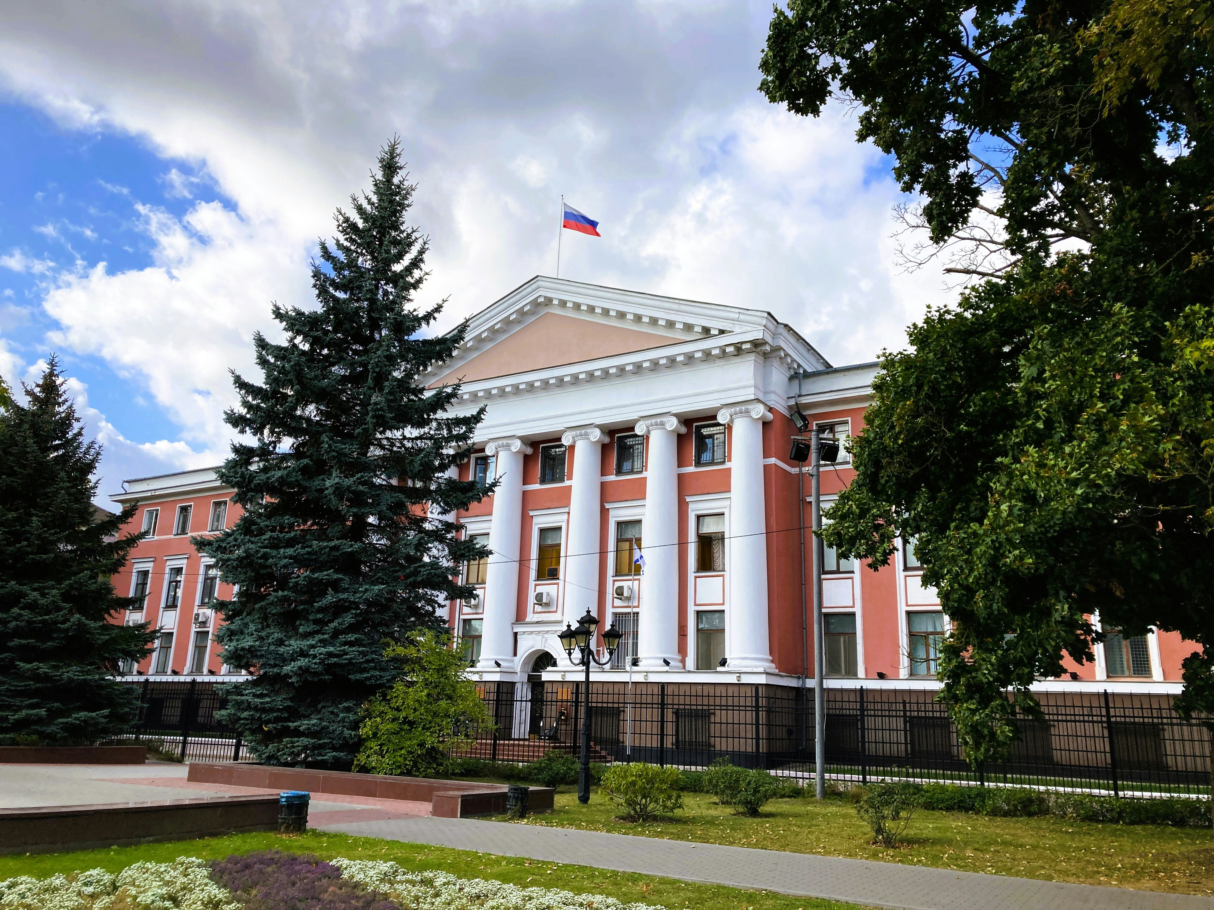 A large building with a flag on top of it