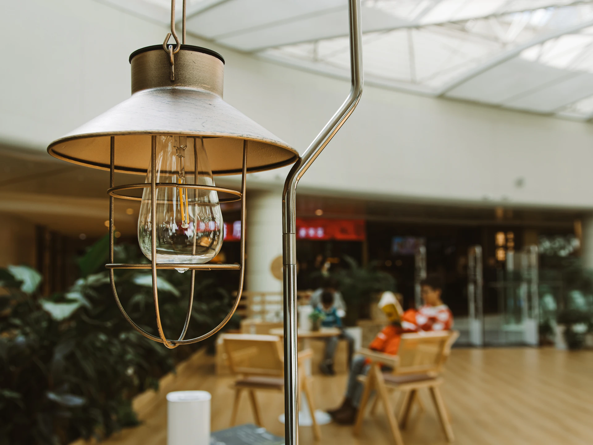 A lamp hanging from a ceiling in a building
