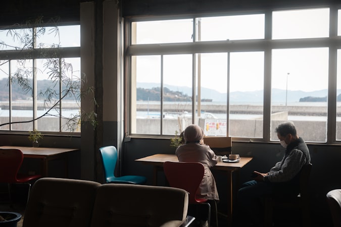 Two people having a focused conversation at a table