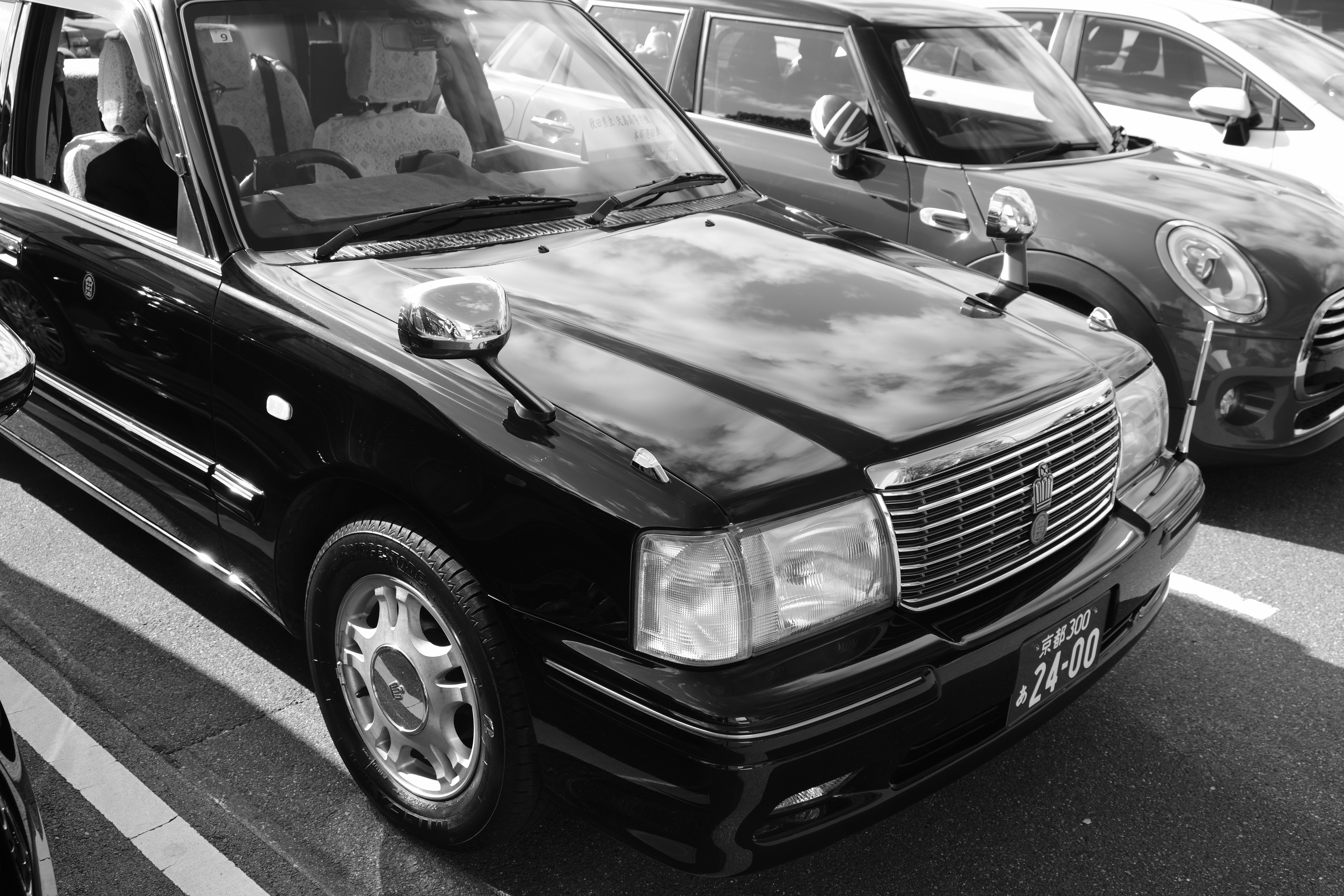 A bunch of cars that are sitting in the street